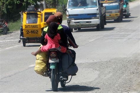 New law bans small children from riding motorcycles .